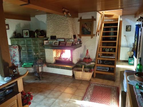 Livingroom with stairs to attic